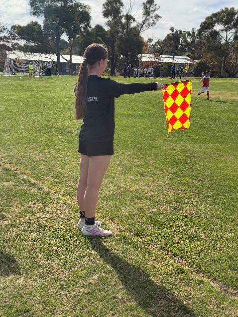 Belwest assistant referee with flag
